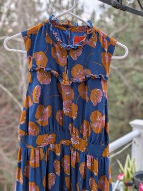 Modcloth Blue Floral Ruffle Neck Midi Dress with Orange & Pink Accent Flowers.